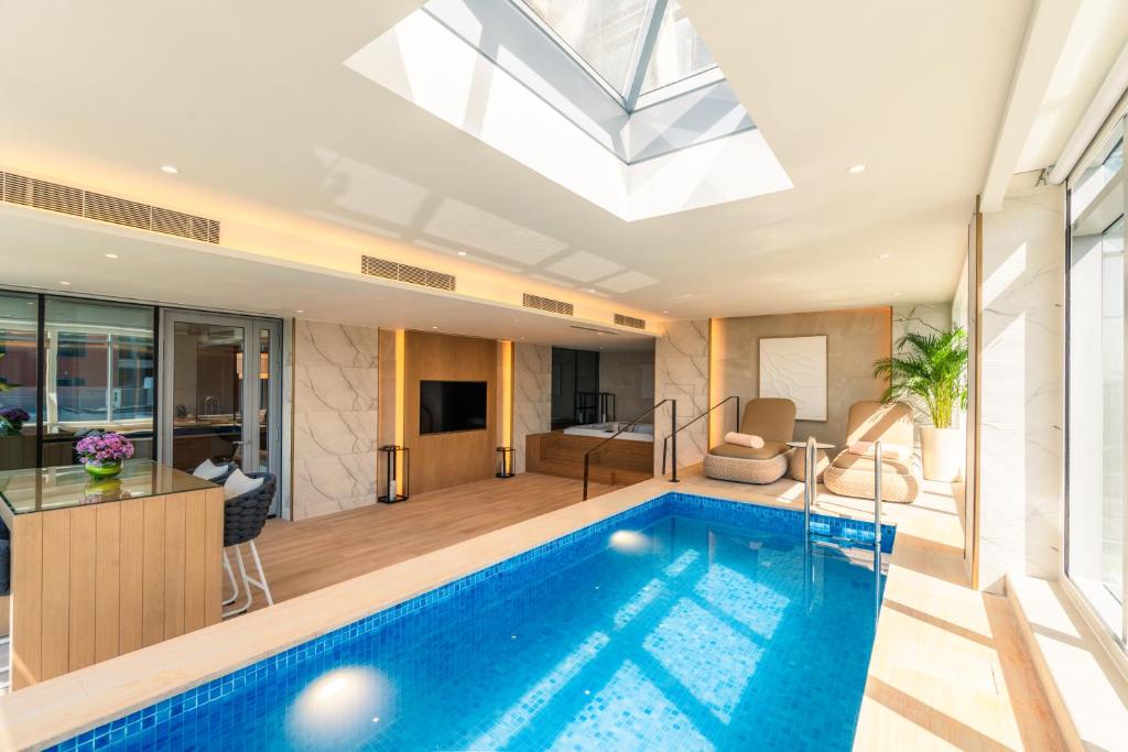 Al Bandar Rotana indoor private plunge pool suite Dubai Creek climate controlled best 2026