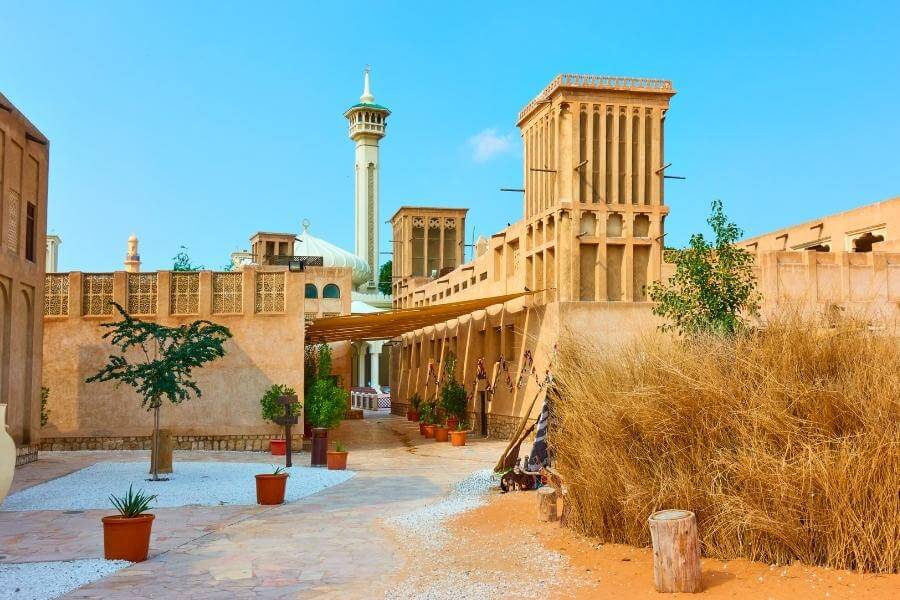 Traditional wind-tower architecture and narrow sandy lanes in the Al Fahidi Historical Neighbourhood, Old Dubai