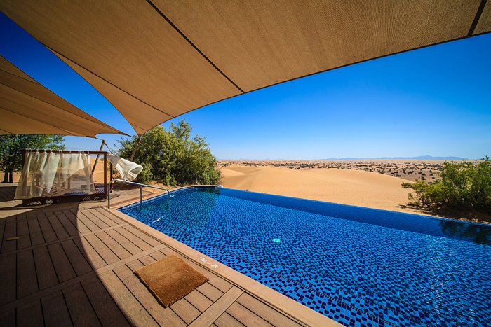 Al Maha Desert Resort Dubai private pool suite with desert dunes and Arabian oryx