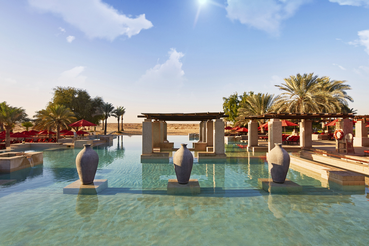 Bab Al Shams desert resort panoramic infinity pool overlooking Al Qudra dunes sunset Dubai