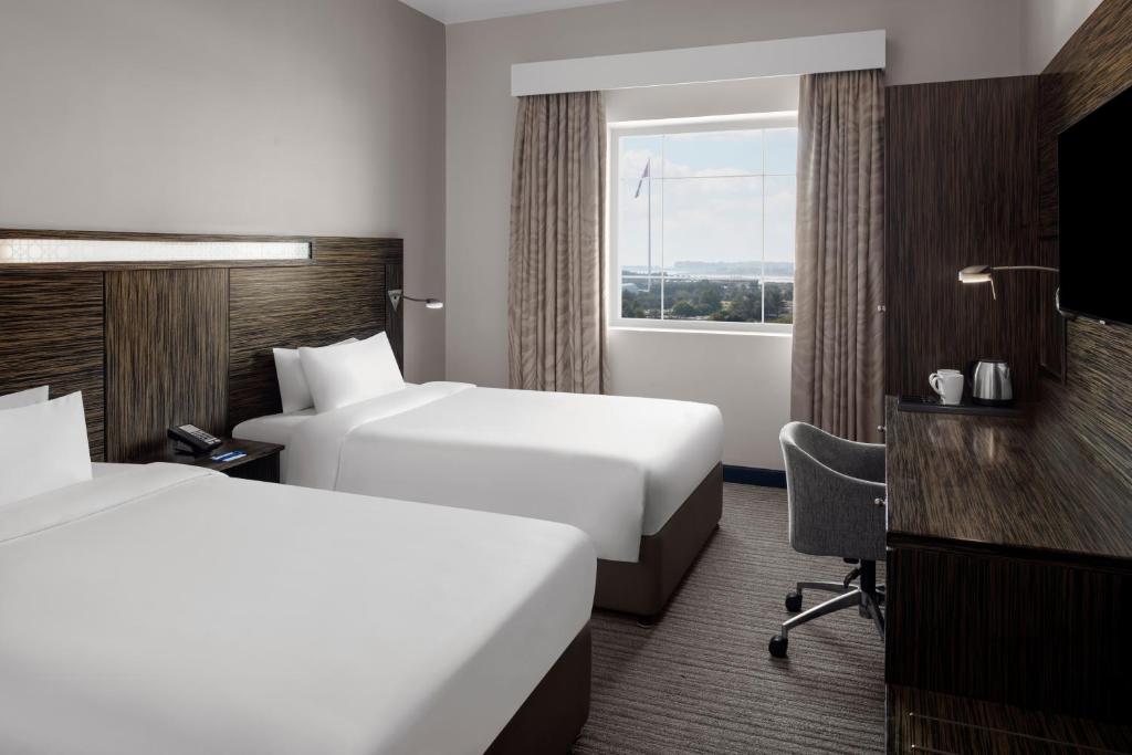Holiday Inn Express Dubai Airport with covered walkway to Terminal 3