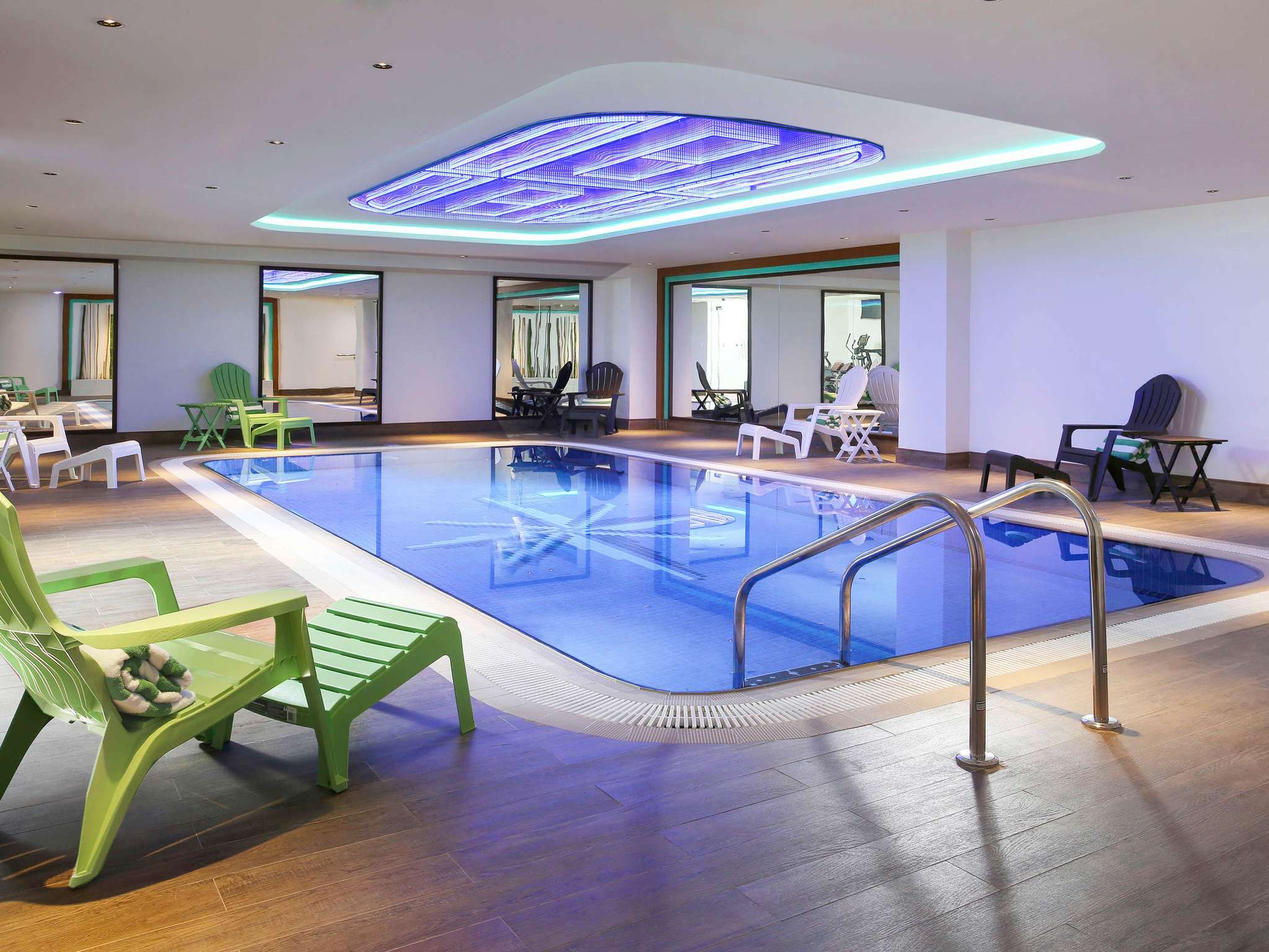 ibis Styles Dubai Jumeira hotel colourful design-forward room interior with Arabic-inspired artwork