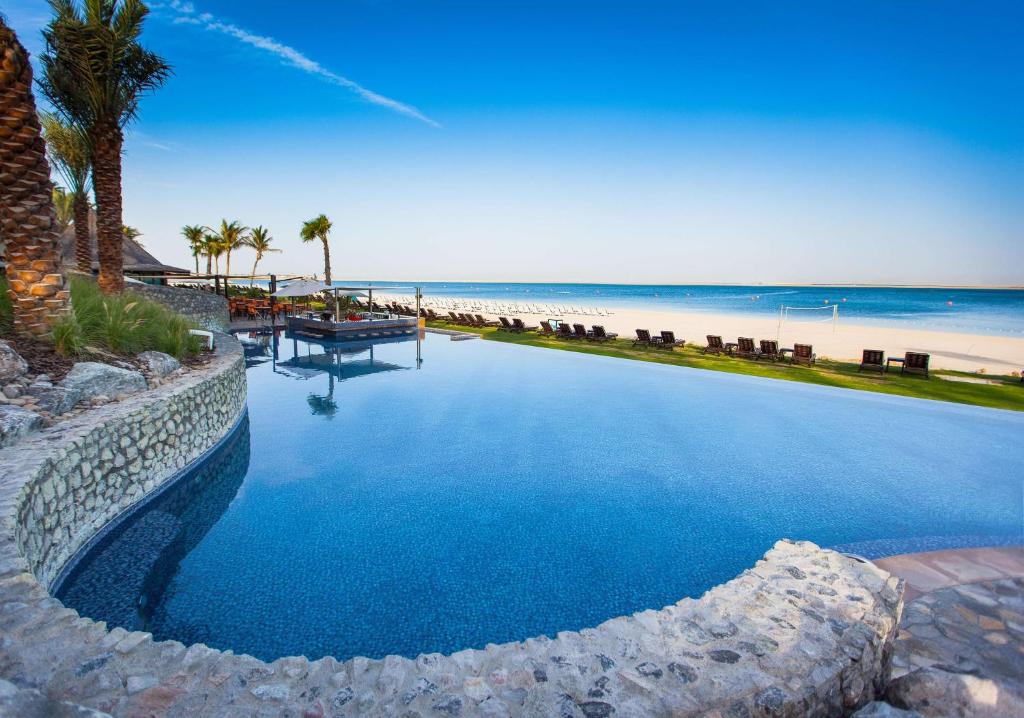 JA Palm Tree Court 80 meter long lap pool adults only Jebel Ali Dubai resort tropical gardens