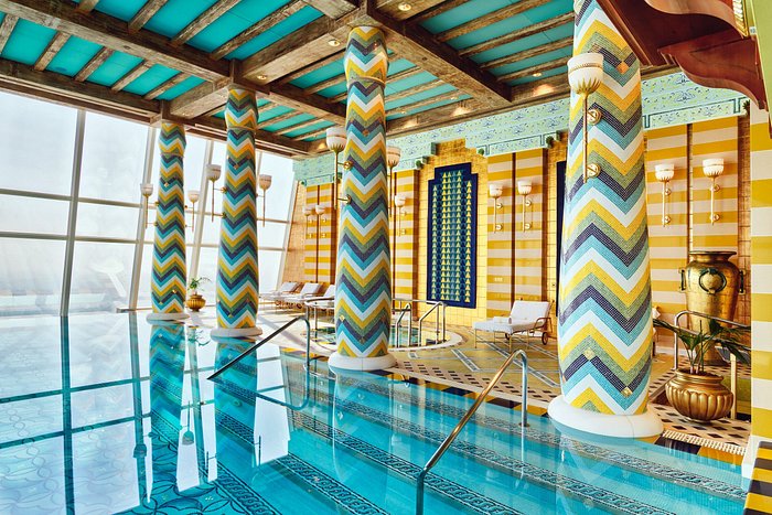 Jumeirah Al Qasr 120 meter long canal infinity pool with Burj Al Arab view Madinat Jumeirah Dubai