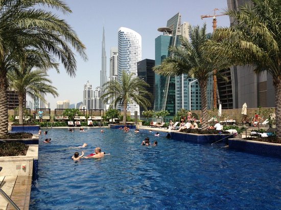 JW Marriott Marquis Hotel Dubai twin towers in Business Bay with rooftop pool and Burj Khalifa skyline view