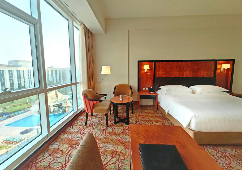 Millennium Airport Hotel Dubai with large pool for waiting families
