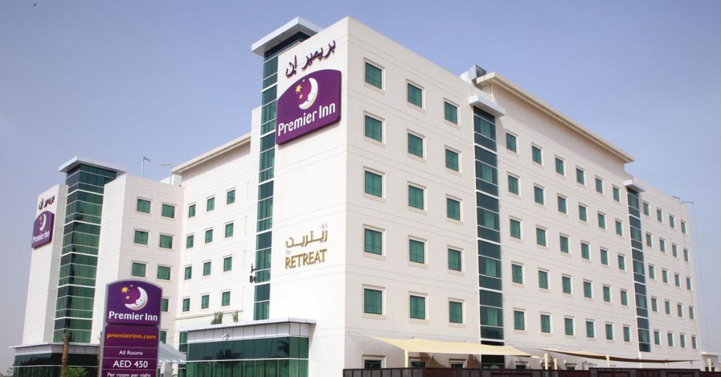 Premier Inn Dubai International Airport hotel exterior and pool