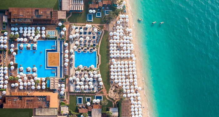 Rixos Premium Dubai JBR 70 meter lagoon infinity pool with swim up bars and DJ booth JBR Walk