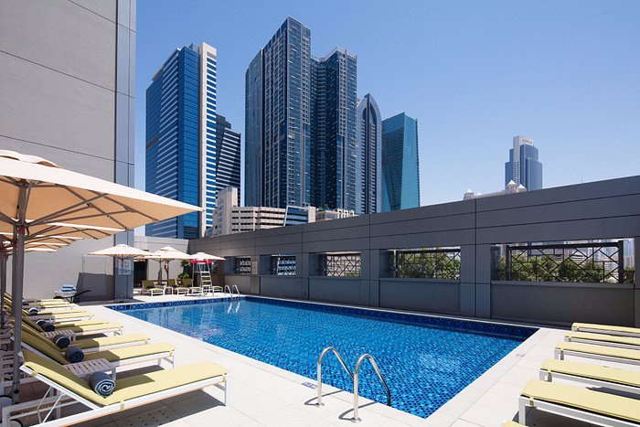 Rove Downtown Dubai outdoor pool with Burj Khalifa view in the background