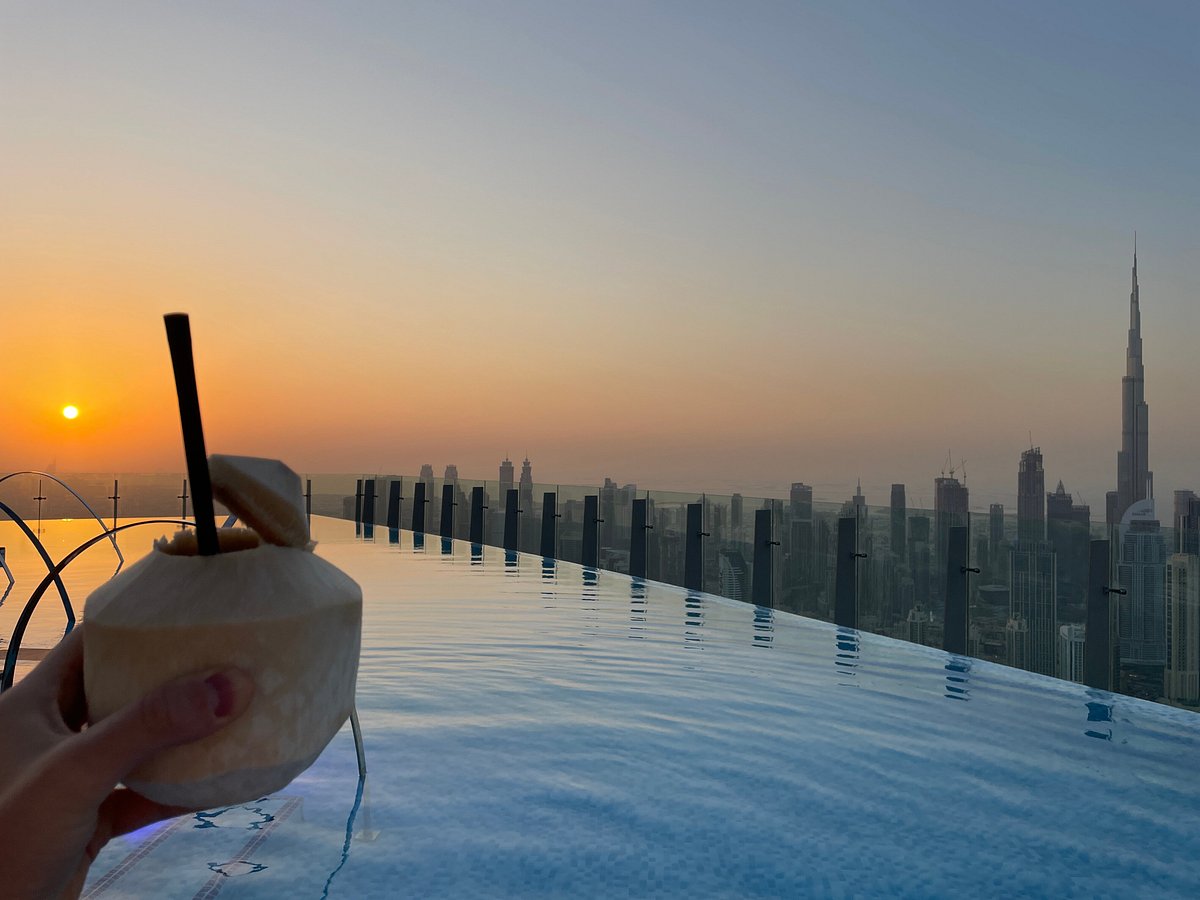 SLS Dubai Hotel rooftop infinity pool in Business Bay with Burj Khalifa skyline view and Fi'lia restaurant