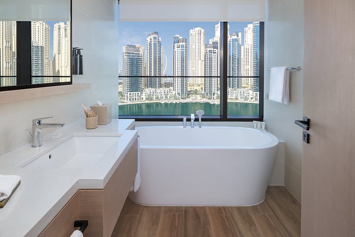 Vida Dubai Marina suite with jacuzzi on balcony overlooking yachts and Marina skyline