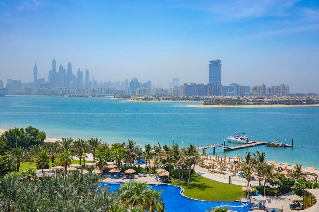 Waldorf Astoria Dubai Palm Jumeirah resort with private beach, pools and palm tree gardens